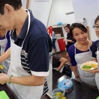 Participants preparing and serving food together at a Silver Wellbeing cooking workshop.