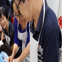 Community members preparing food together